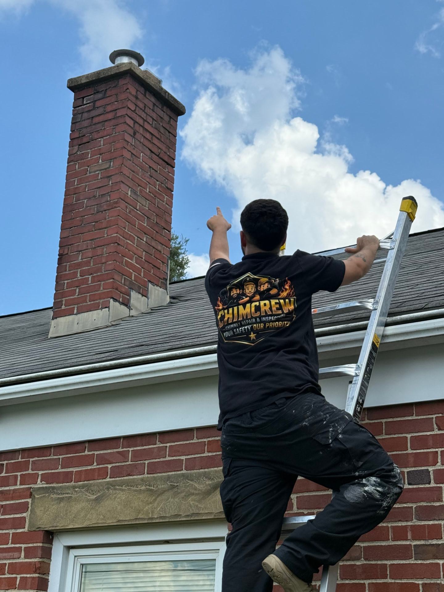 ChimCrew technician inspecting a chimney from a ladder