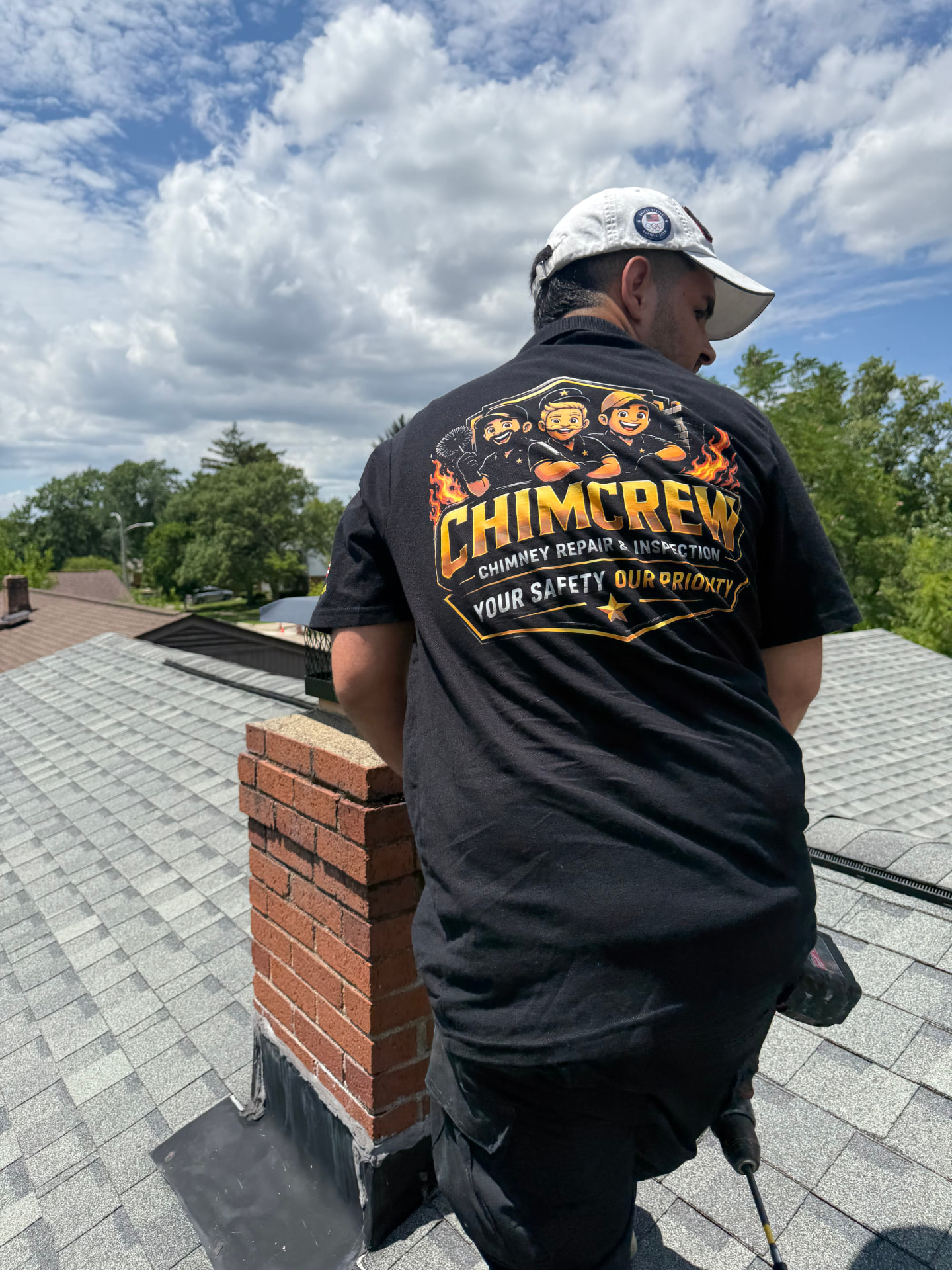 ChimCrew technician working on a brick chimney